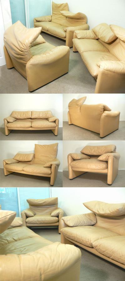 A 1970s 'Maralunga' sofa suite. Designed by Vico Magistretti for Cassina. Comprising a pair of two seater sofa's and one armchair. Upholstered in Light beige/sand coloured hide.