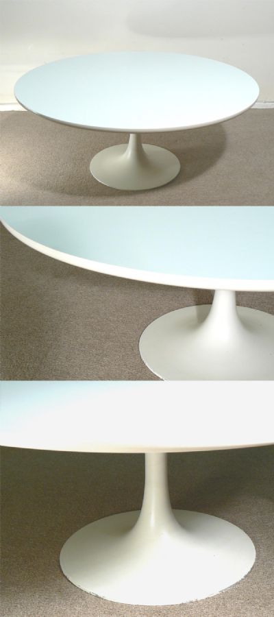 An Arkana coffee table, c1970s. White laminated top with cast metal pedestal base.
