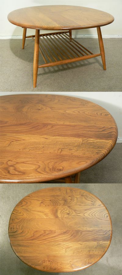 A large round Ercol coffee table. Wonderful figured elm top with beech leg section. c1960s.