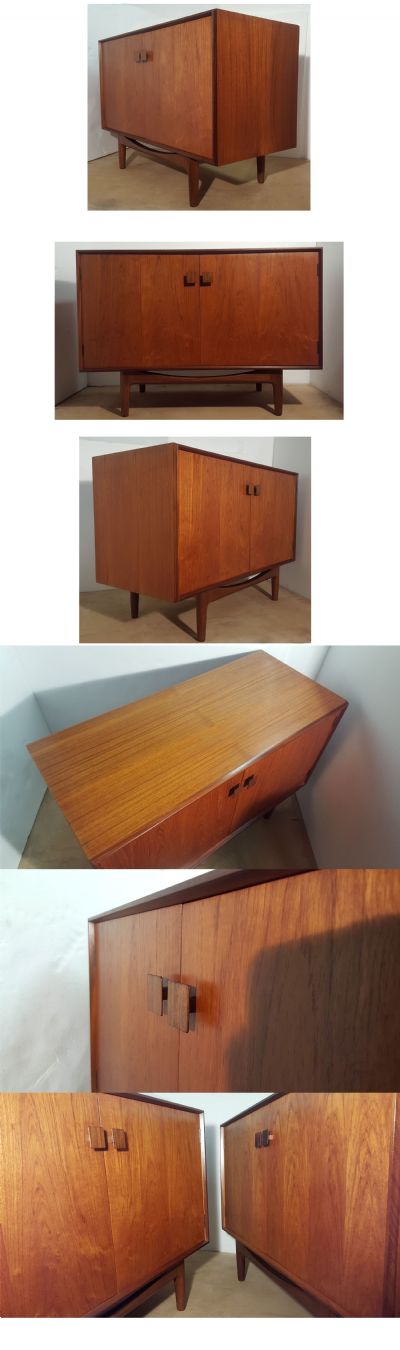 A teak cupboard by Kofod Larsen for G-Plan, c1960s. One of a pair available 